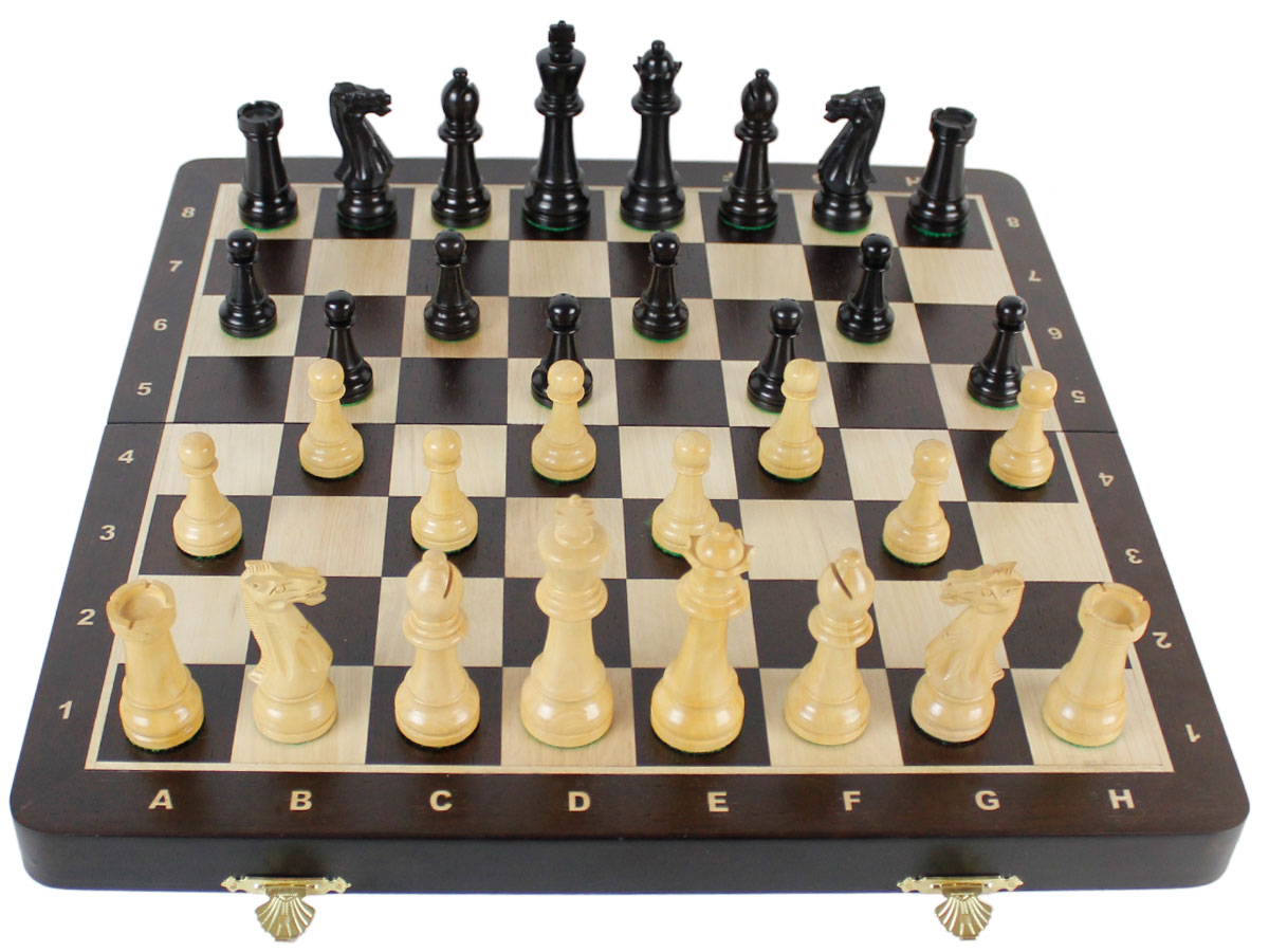 Fully open chess board with laughing knight staunton chess pieces