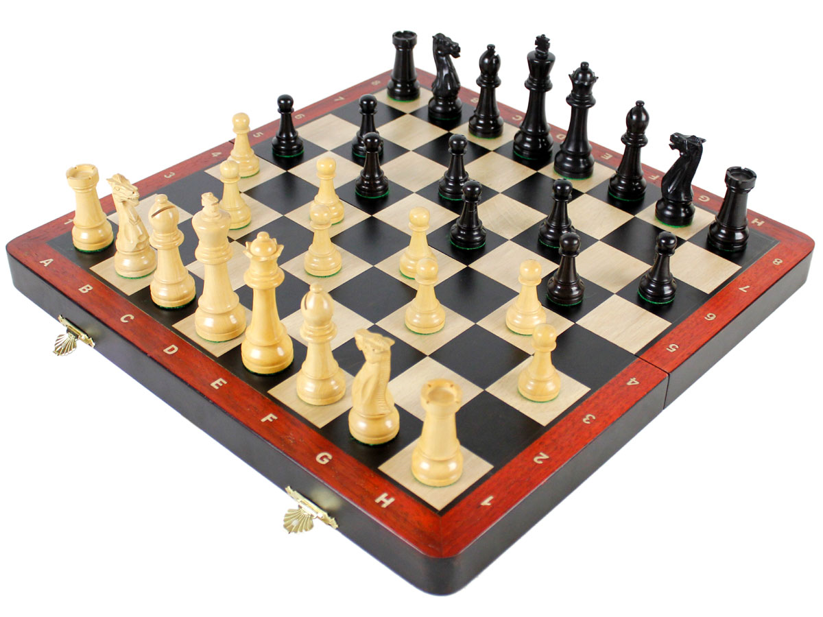 Fully open chess board with laughing knight staunton chess pieces