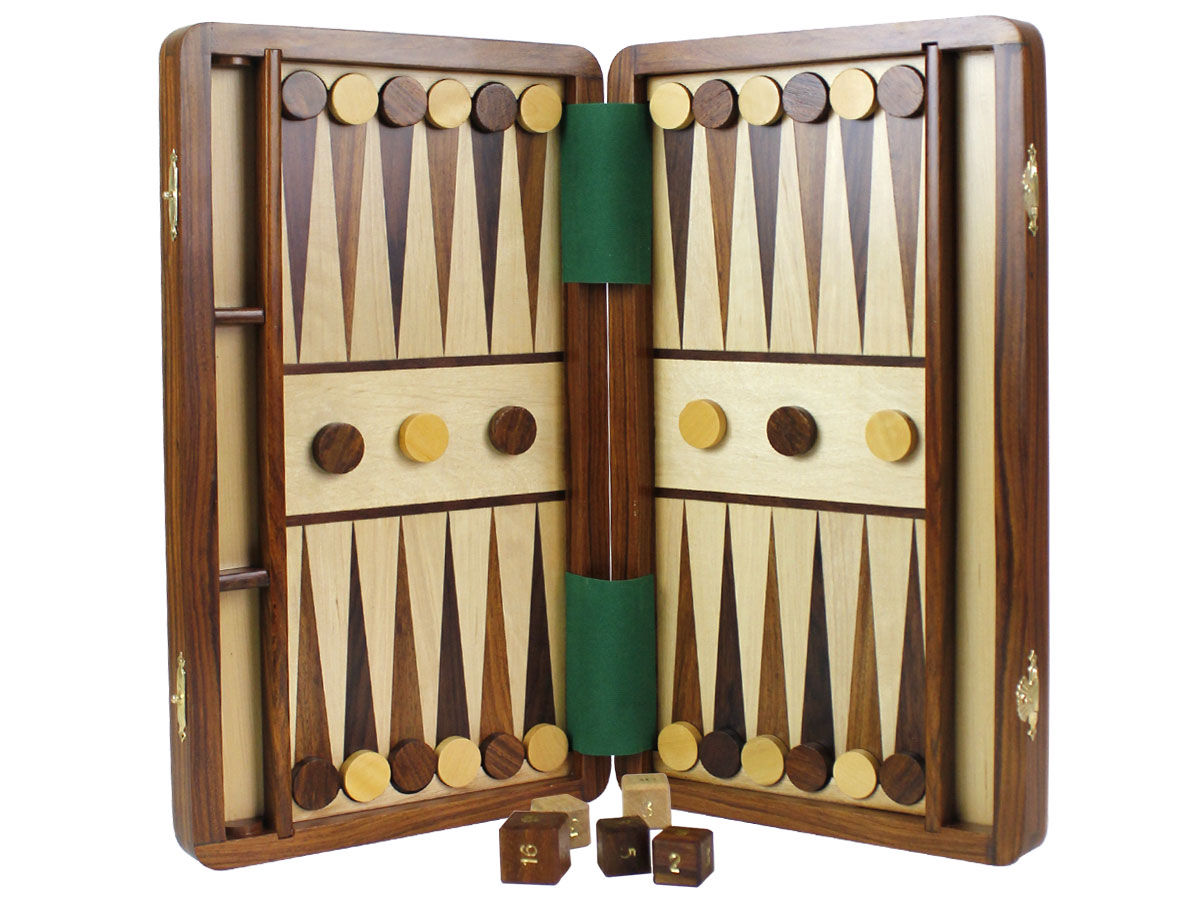 Magnetic Backgammon board held upside down with checkers attached to board