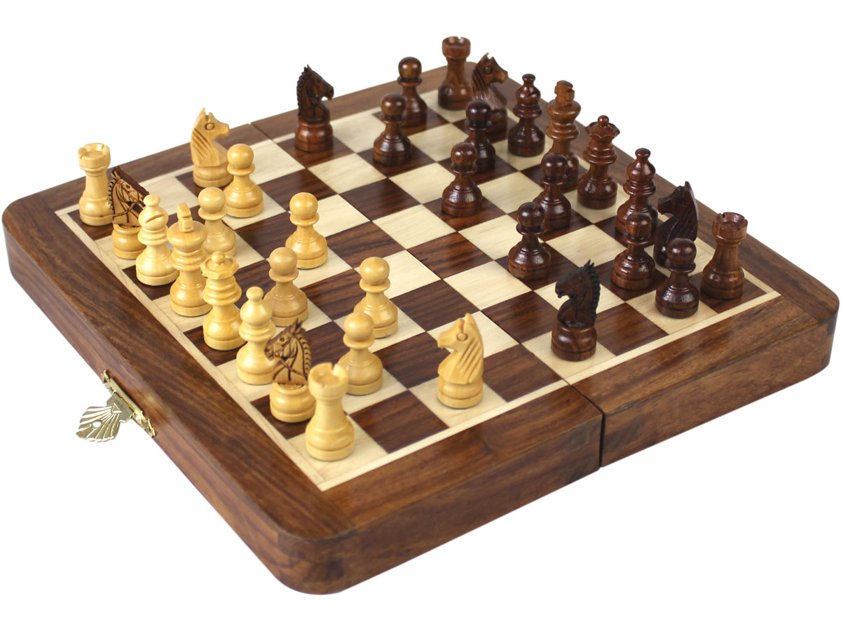 Side view of fully open chess board with pieces on top