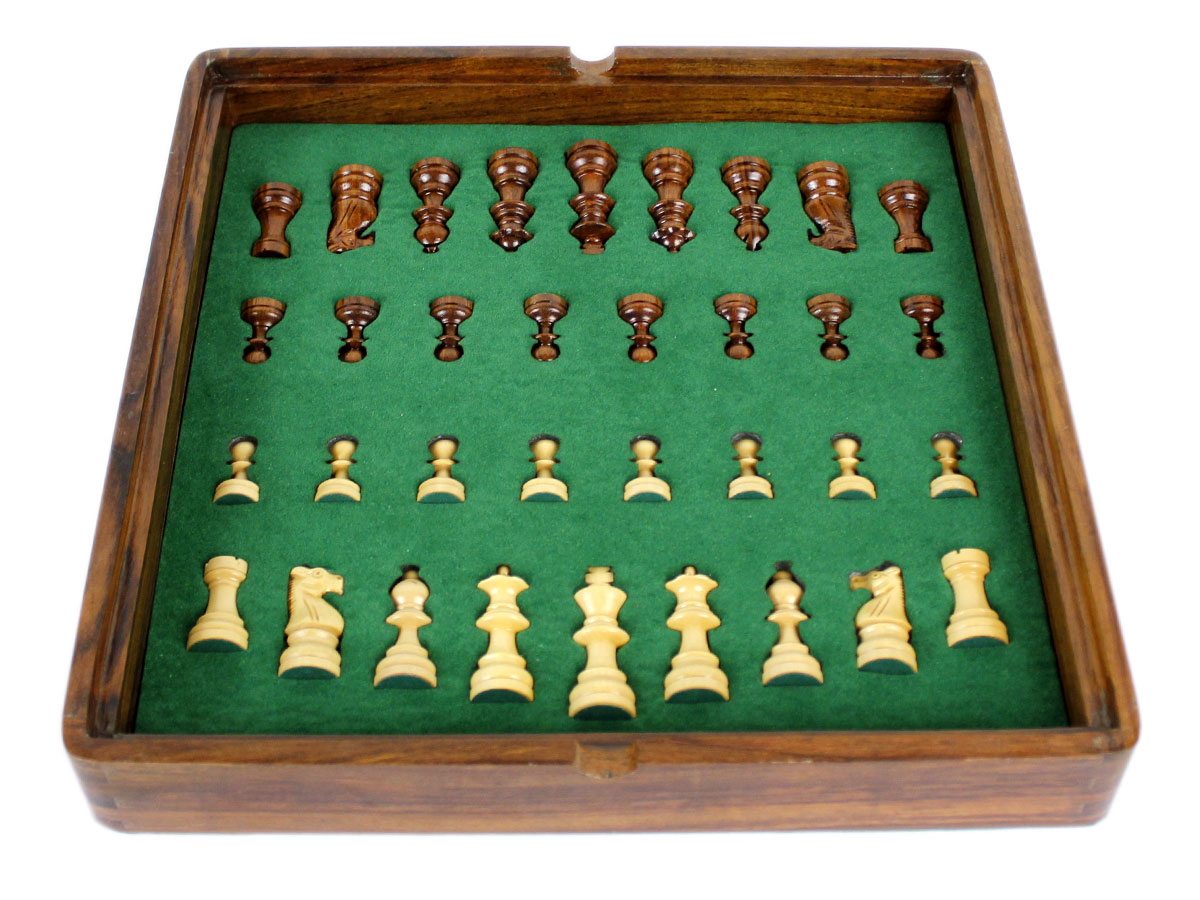 Inner view of chess box with pieces inside tray