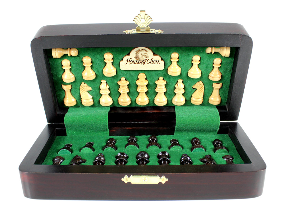 Chess pieces fitted in special inserts made according to the shape of the chess pieces.
