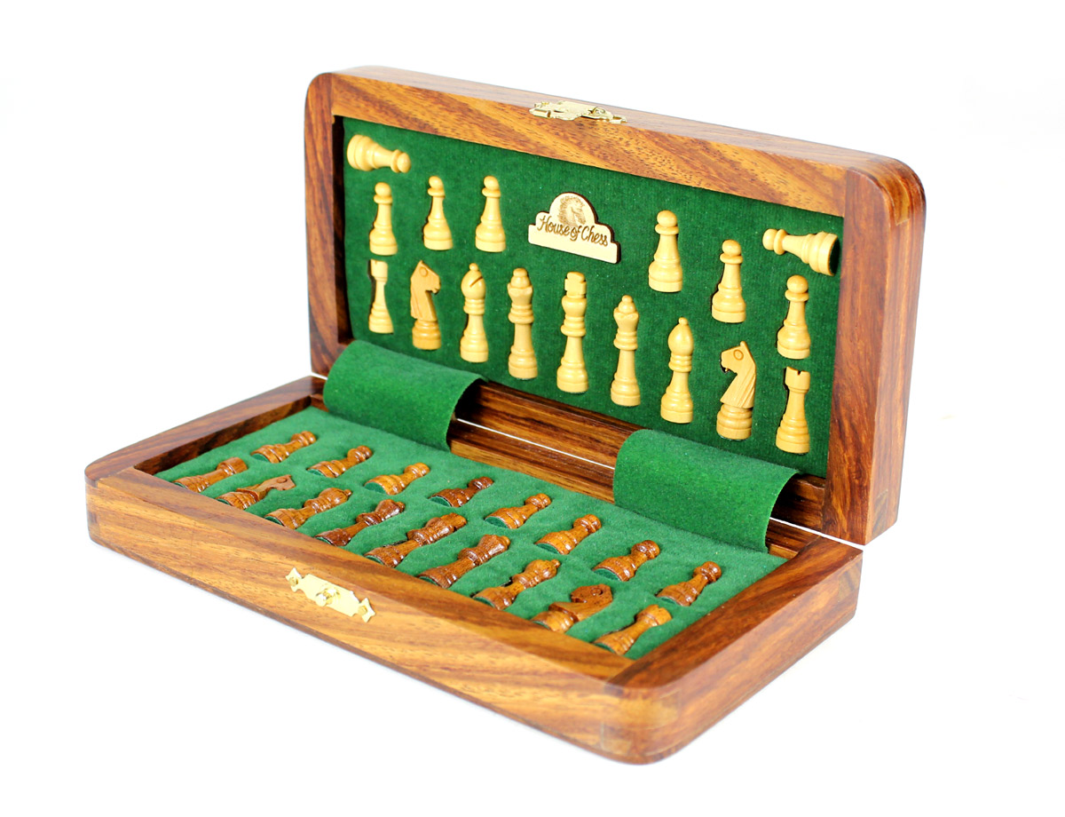 Chess pieces fitted in special inserts made according to the shape of the chess pieces.