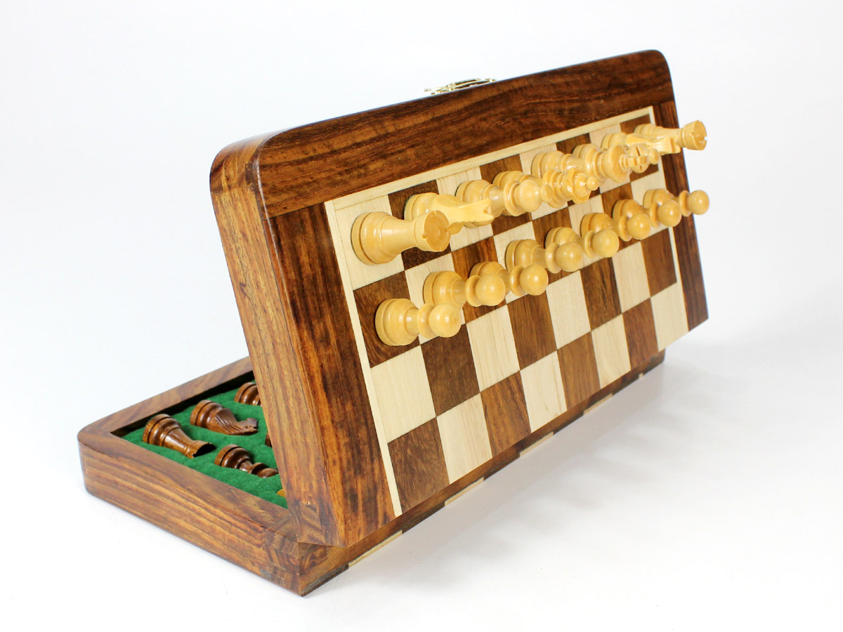 Side view of folding chess set with pieces attached to board