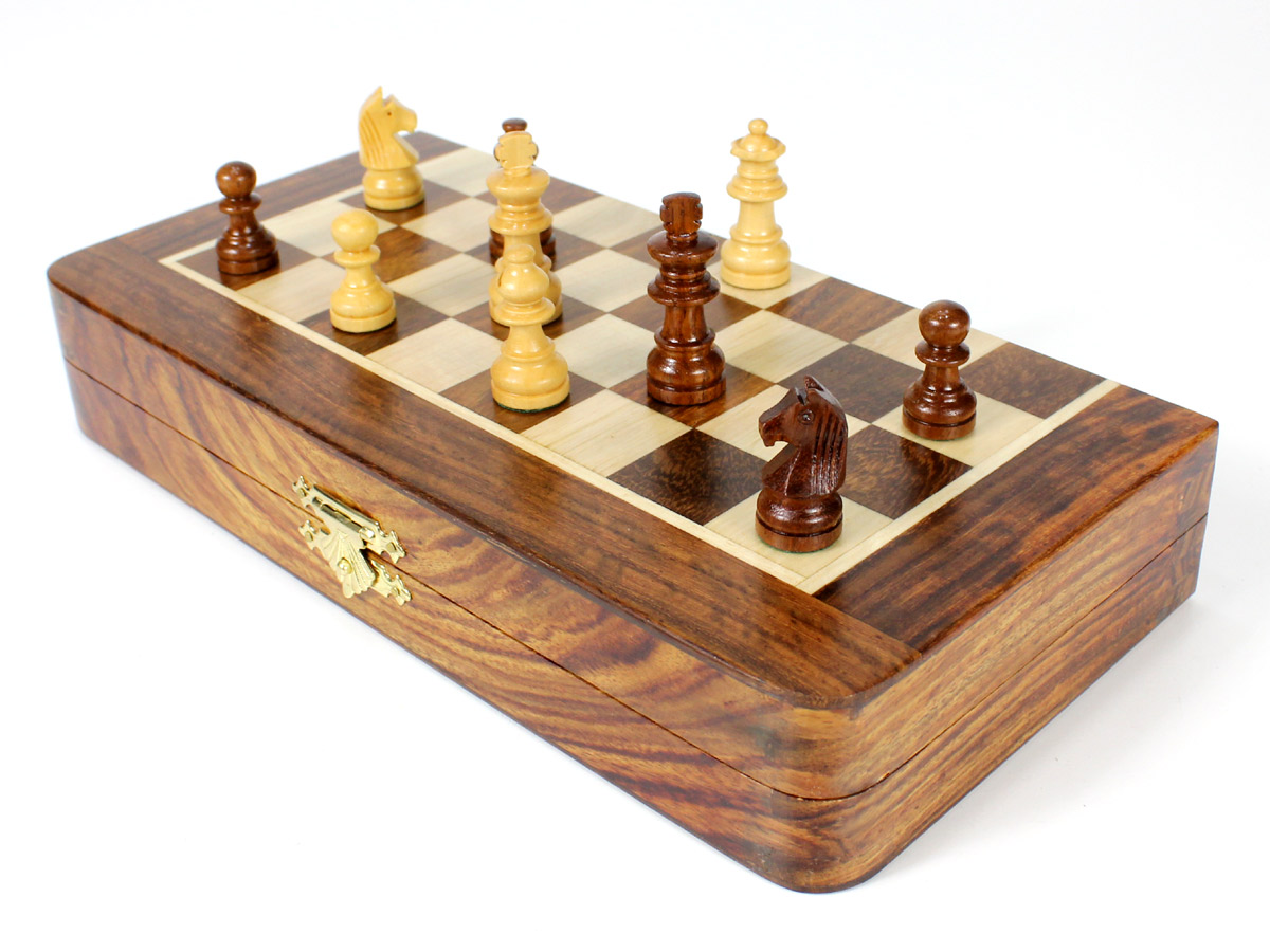 Front view of half folded chess board with pieces