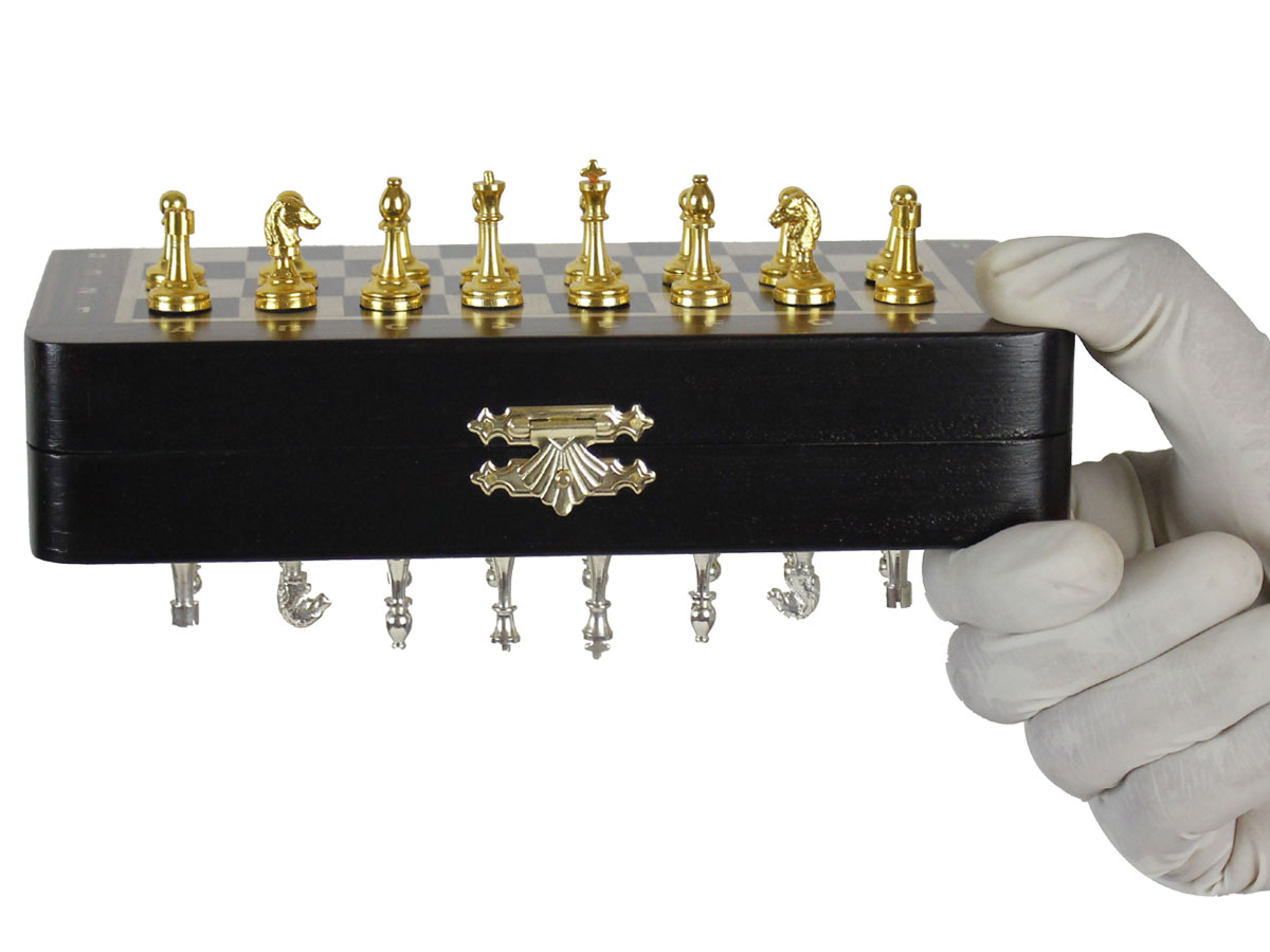 Metal Pieces fitted with super strong magnets attached to board held upside down