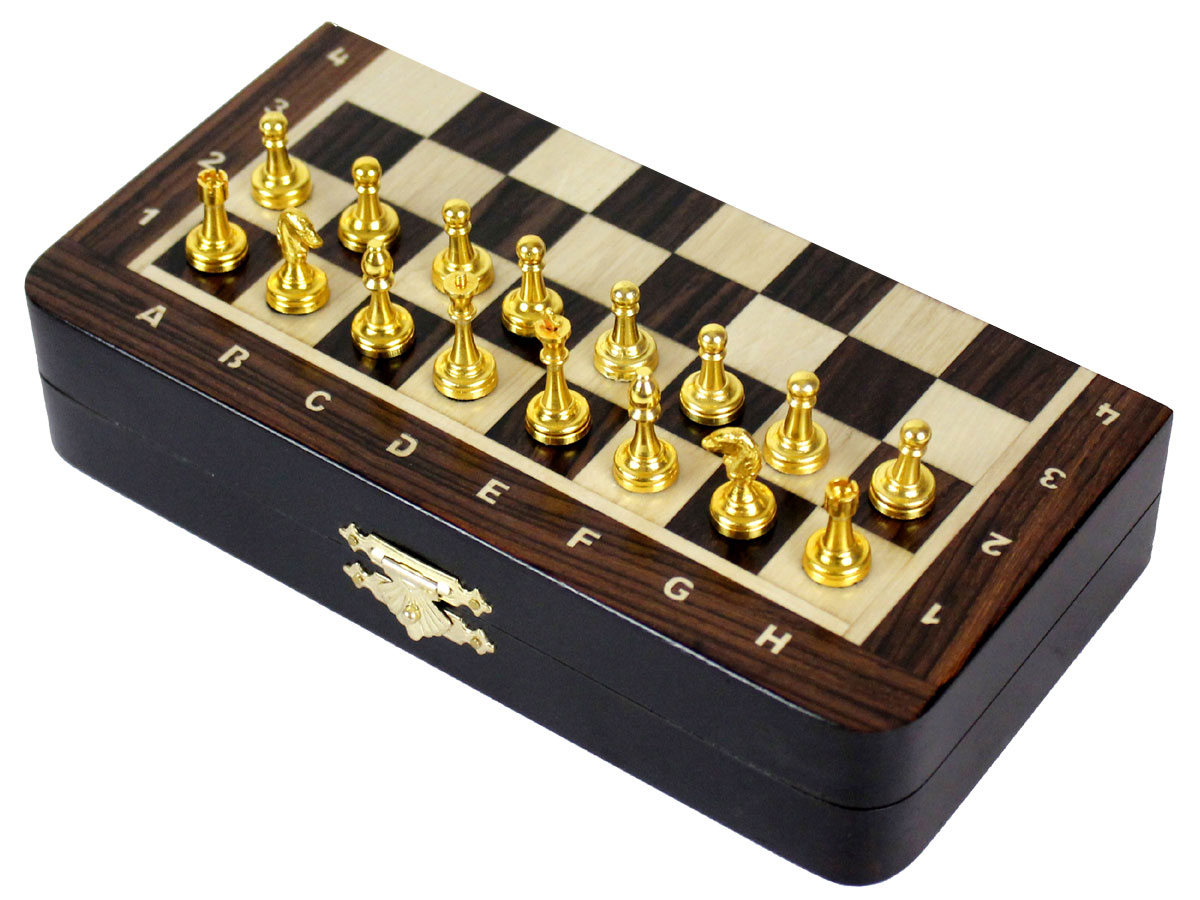 Side view of chess board with metal pieces