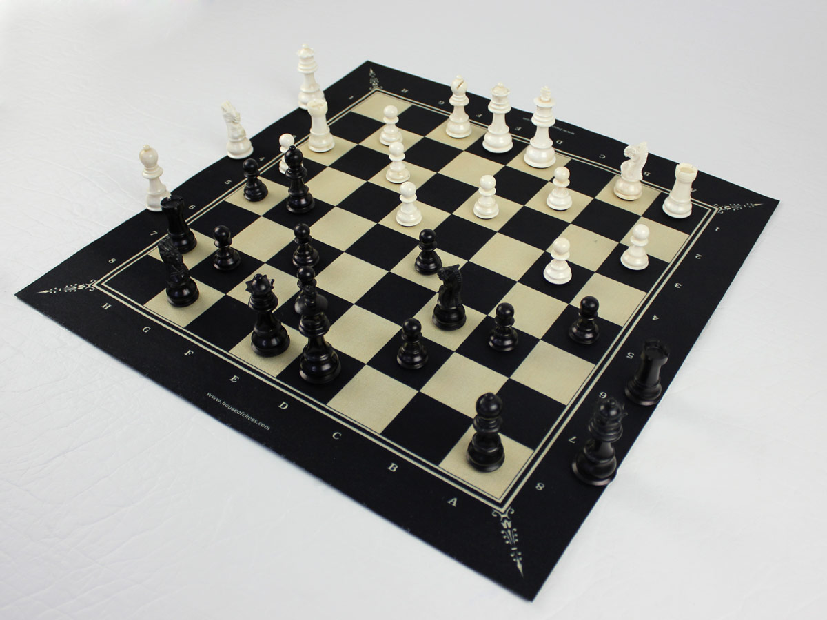 Side view of chess board  with bone pieces
