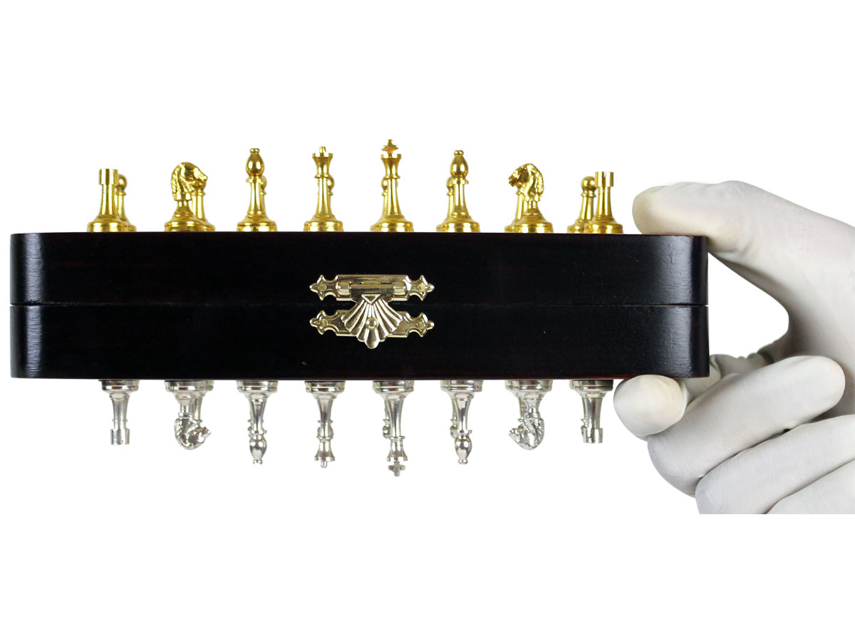 Metal Pieces fitted with super strong magnets attached to board held upside down