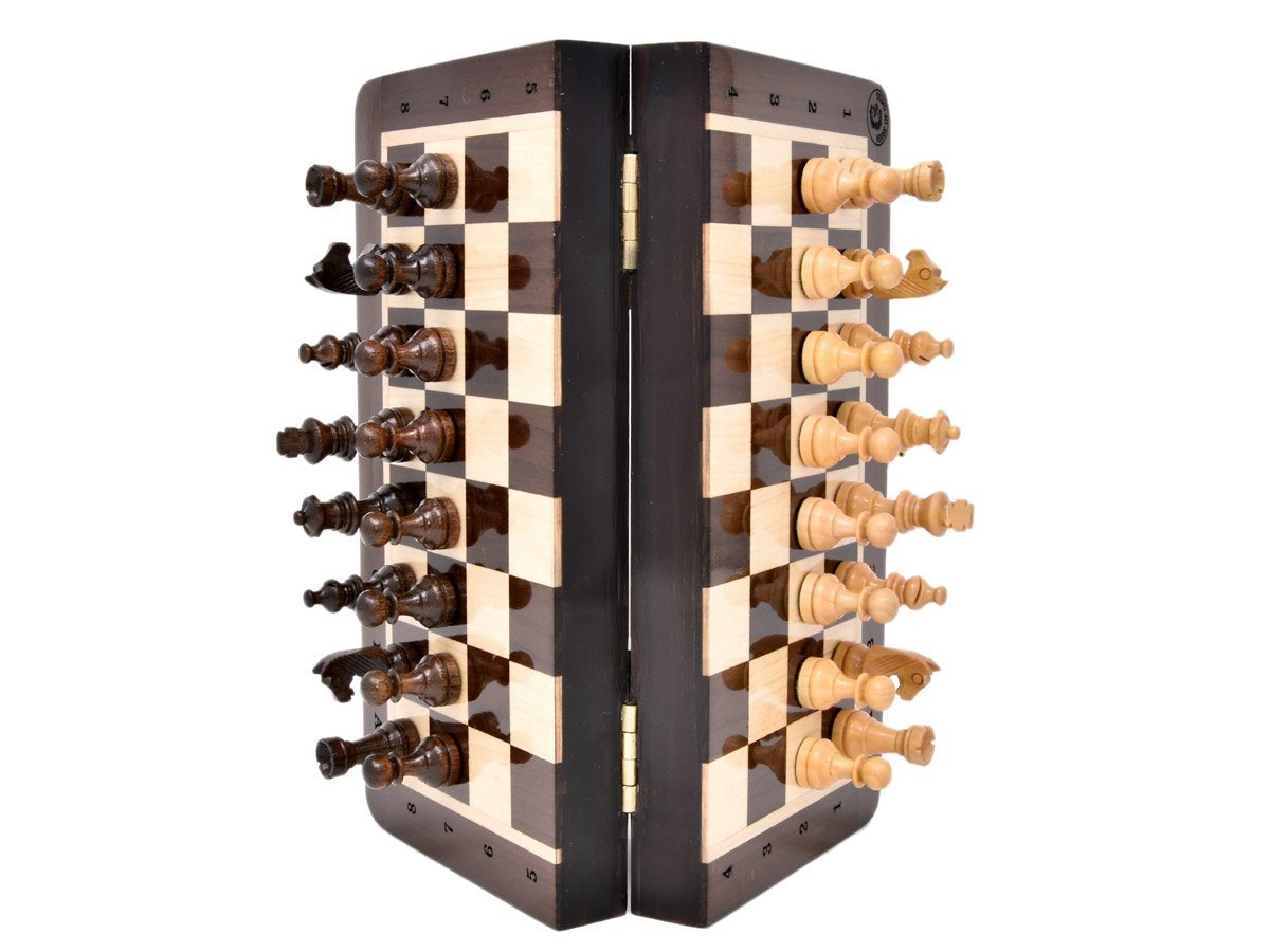 Vertically positioned chess board/box with magnetic pieces attached to it