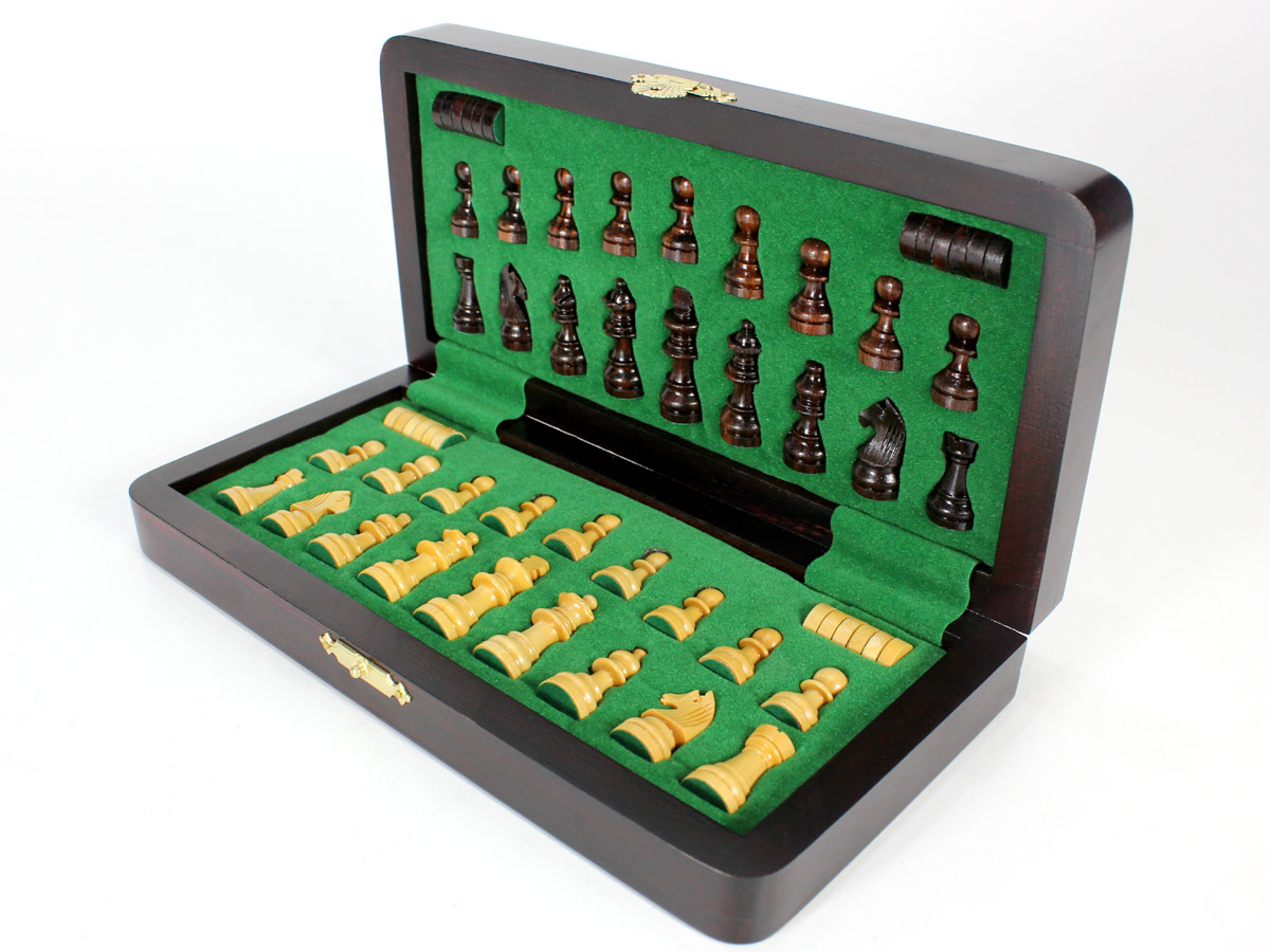 Inner view of chess box with pieces and checkers inserted