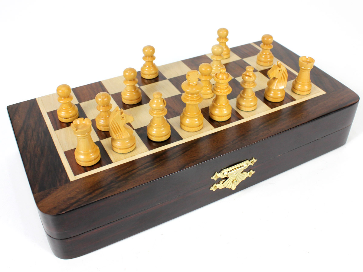 Front view of half folded chess board with pieces