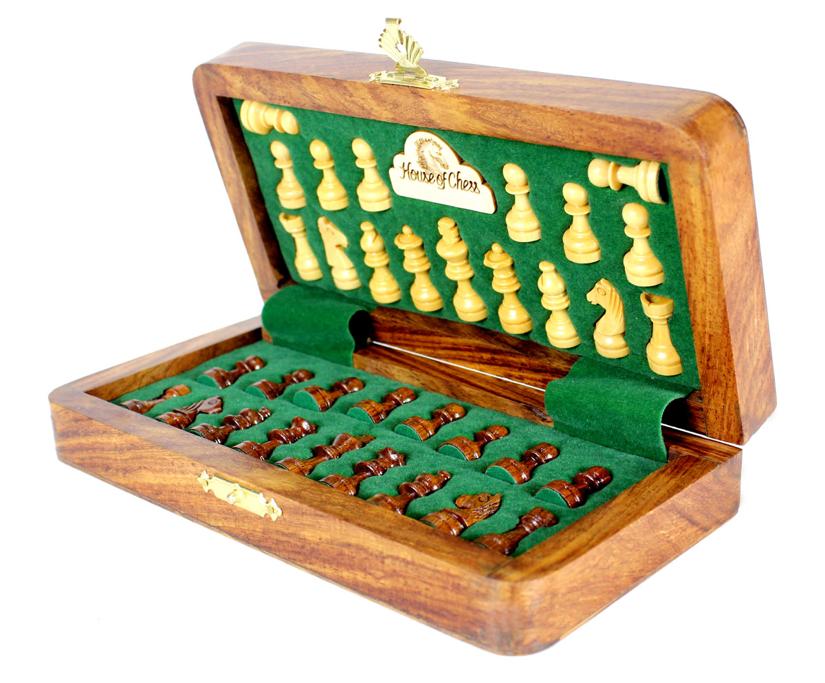 Chess pieces fitted in special inserts made according to the shape of the chess pieces.
