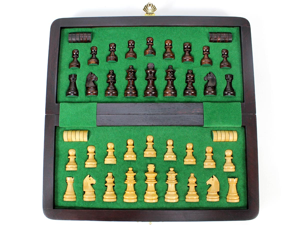 Inner view of chess box with pieces and checkers inserted