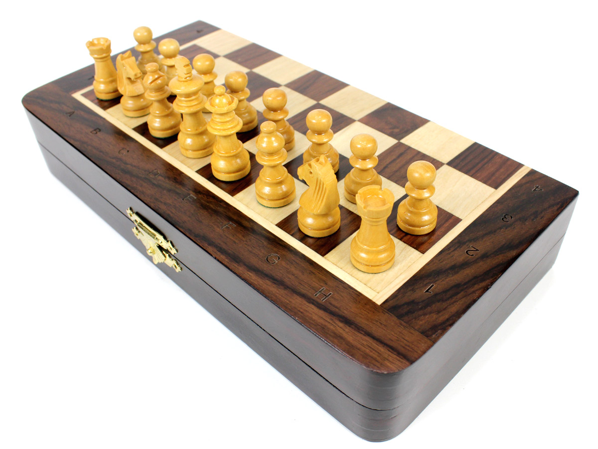 Front view of half folded chess board with pieces