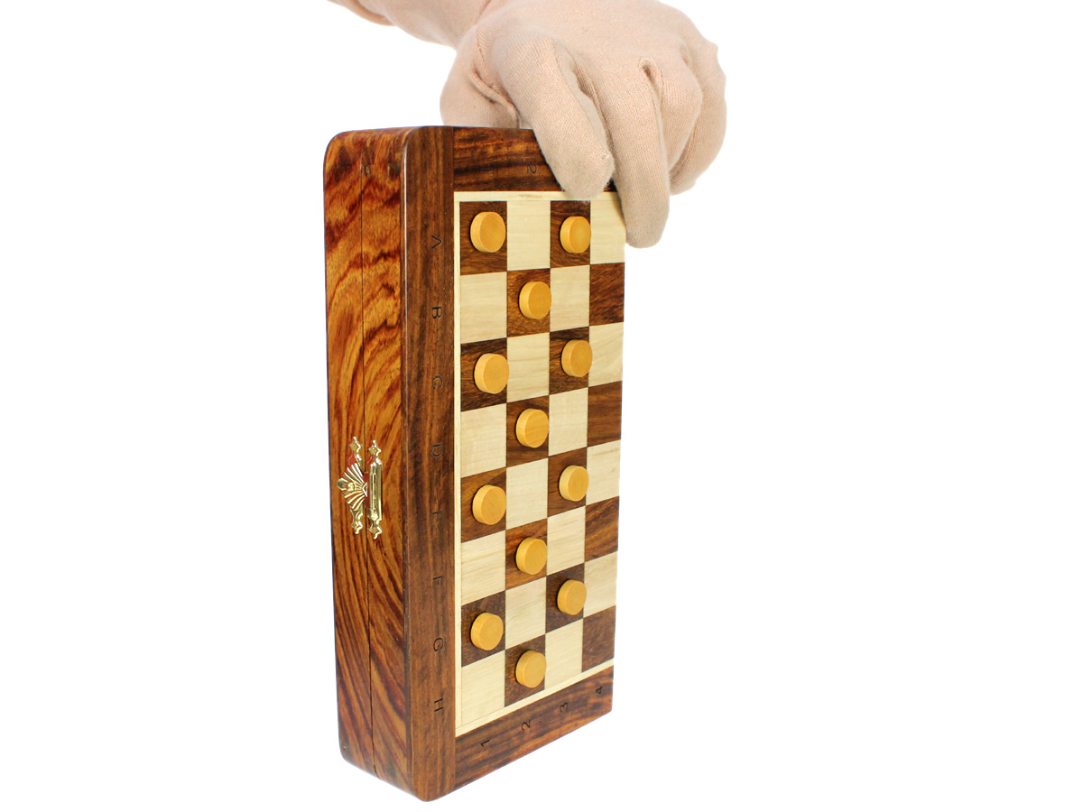 Magnetic Checkers attached to board held vertically