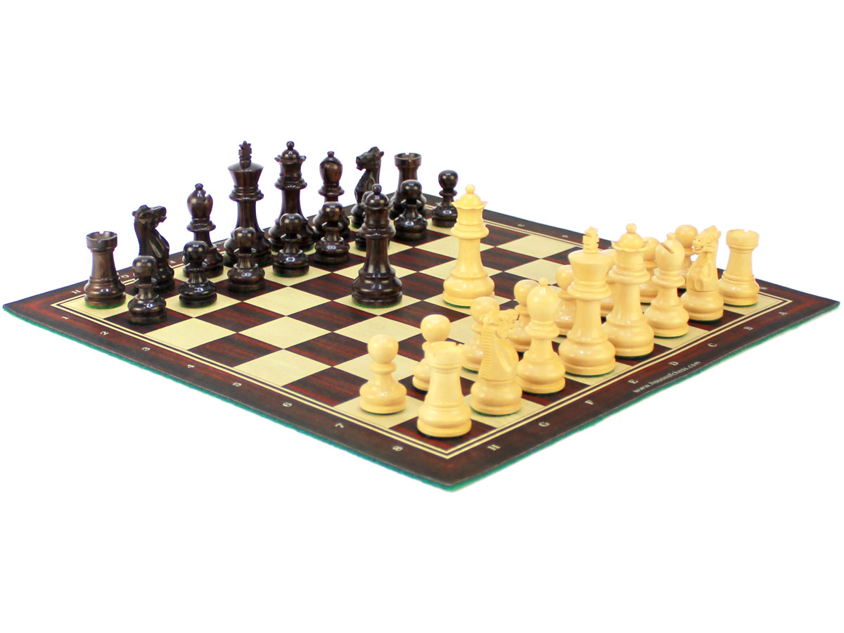 Side view of chess board with wooden monarch pieces on board