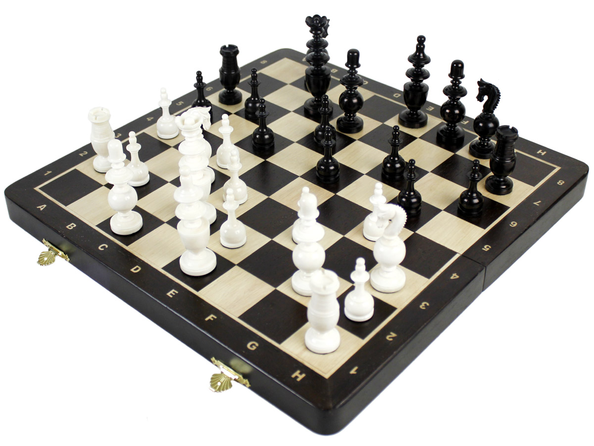 Side view of chess pieces on board with inlaid notations