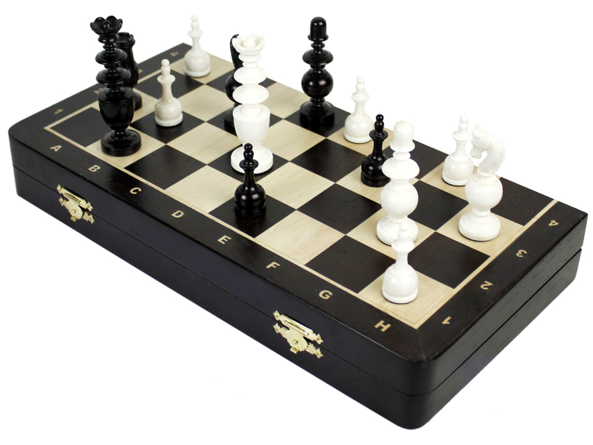 Folding chess board with pieces on top