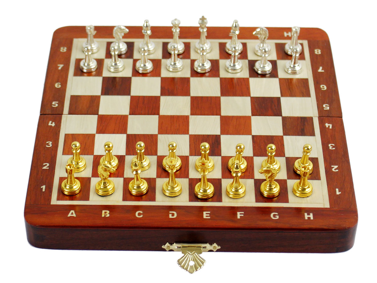 Flat layout of chess board with metal pieces on top