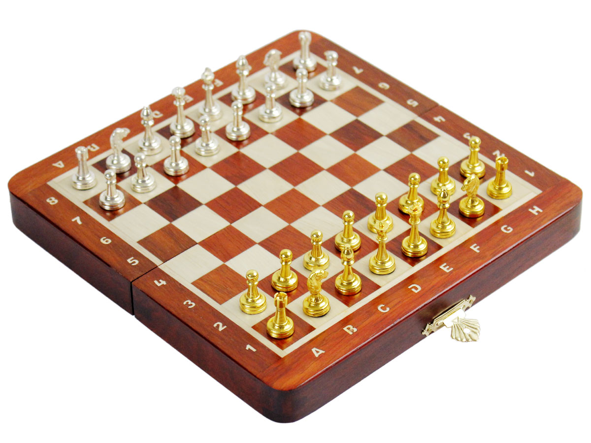 Side view of chess board with metal pieces on top
